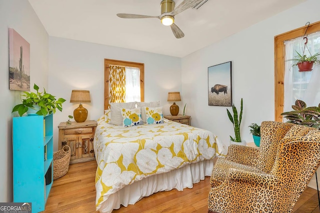 bedroom featuring wood finished floors and a ceiling fan