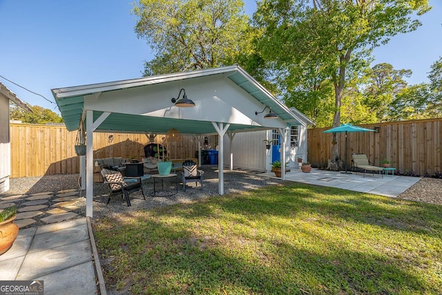 exterior space with a gazebo, outdoor lounge area, a fenced backyard, and a patio