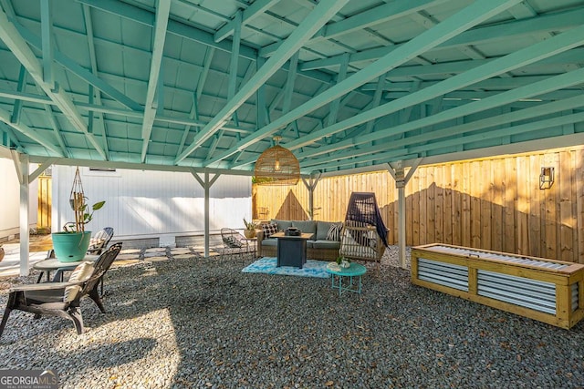 view of patio featuring an outdoor living space and a fenced backyard