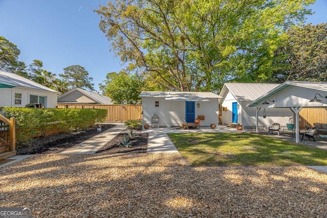 back of house featuring a patio area and fence