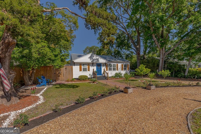 ranch-style house with fence