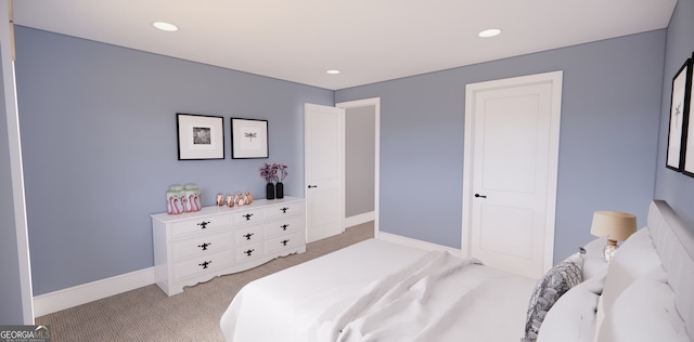 bedroom with baseboards, recessed lighting, and light colored carpet