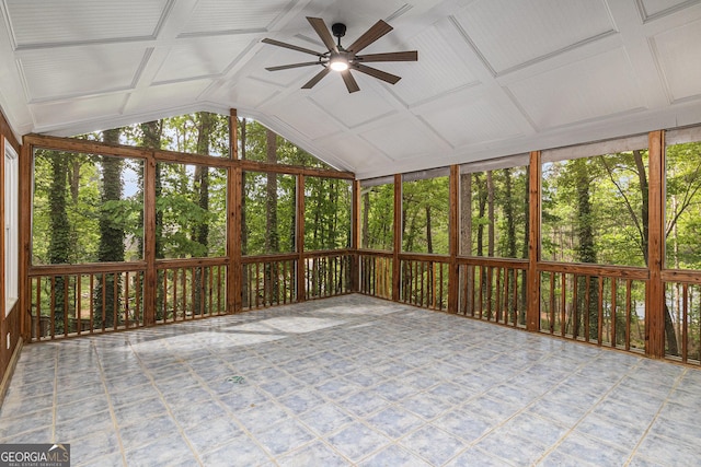 unfurnished sunroom featuring a ceiling fan