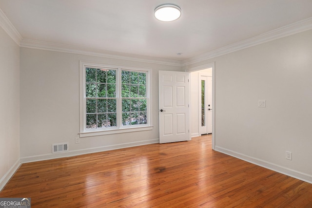 535 Emerald Pkwy, Sugar Hill, GA 30518 - spare room with ornamental molding, light wood-style floors, and baseboards