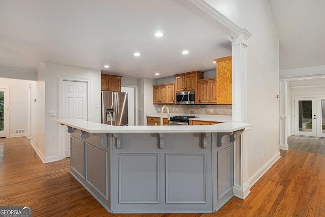 kitchen with stainless steel appliances, recessed lighting, and wood finished floors