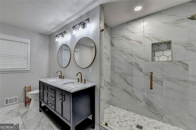 780 N Ola Rd, Mcdonough, GA 30252 - bathroom featuring marble finish floor, toilet, a sink, and visible vents