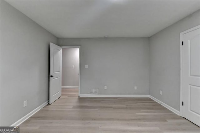 780 N Ola Rd, Mcdonough, GA 30252 - unfurnished room with light wood-style floors, visible vents, and baseboards