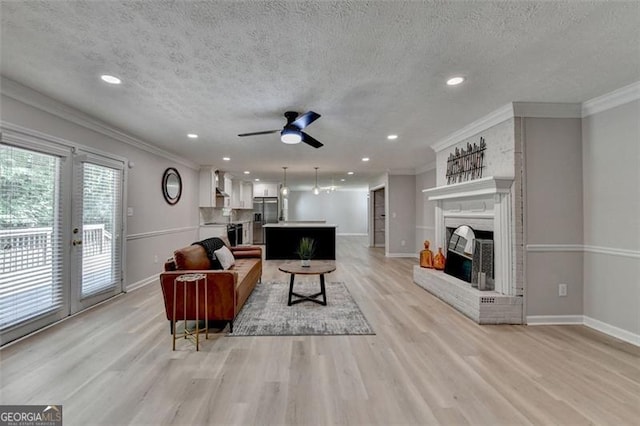 780 N Ola Rd, Mcdonough, GA 30252 - living room featuring baseboards, a brick fireplace, and light wood-type flooring