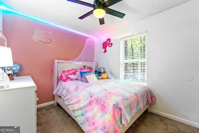 507 Lakeshore Dr, Stockbridge, GA 30281 - carpeted bedroom with lofted ceiling, baseboards, and ceiling fan