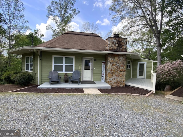 426 Shenendoa Dr, Ellijay, GA 30540 - rear view of property with a porch, a chimney, and a shingled roof