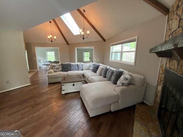 426 Shenendoa Dr, Ellijay, GA 30540 - living room featuring a chandelier, beam ceiling, a stone fireplace, dark wood-type flooring, and high vaulted ceiling