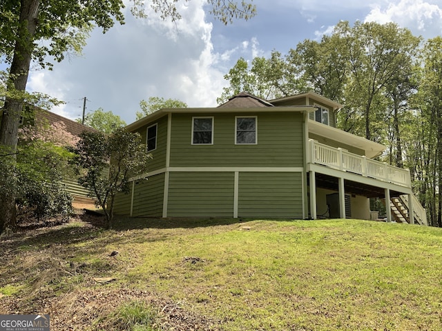 426 Shenendoa Dr, Ellijay, GA 30540 - back of property with stairway, a wooden deck, and a lawn