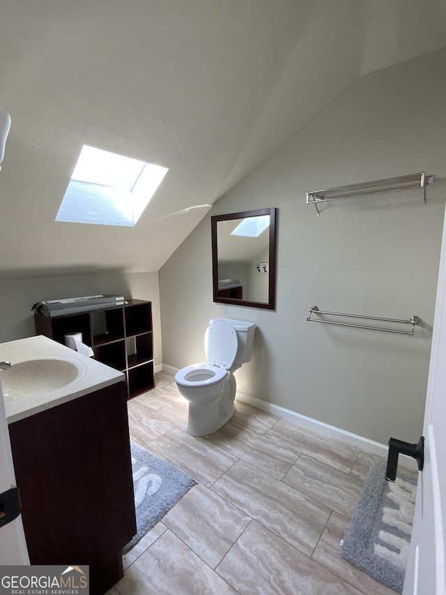 426 Shenendoa Dr, Ellijay, GA 30540 - bathroom with a skylight, lofted ceiling, and vanity