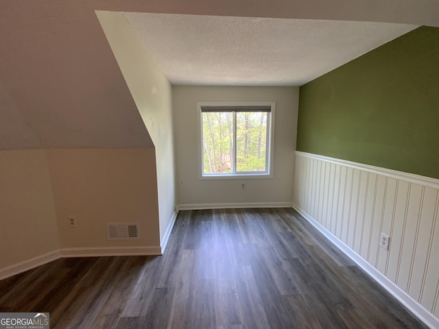 426 Shenendoa Dr, Ellijay, GA 30540 - additional living space with dark wood-style flooring and a textured ceiling