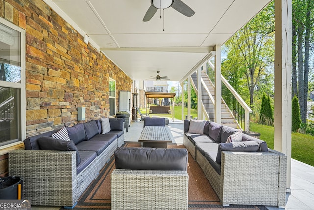 view of patio with a ceiling fan, stairs, and an outdoor hangout area