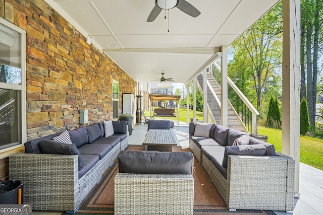 view of patio / terrace with stairs, ceiling fan, and an outdoor hangout area