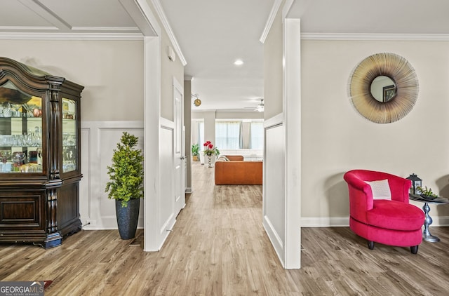 hallway featuring wood finished floors, recessed lighting, and crown molding