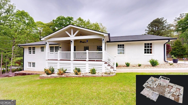 view of front of property with a ceiling fan, brick siding, a front yard, and covered porch