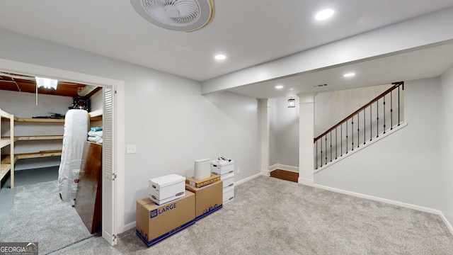 finished basement with carpet flooring, recessed lighting, stairs, and baseboards