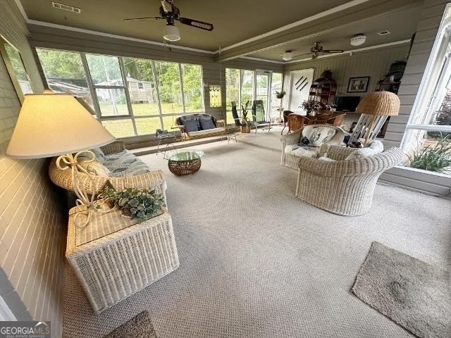 sunroom / solarium featuring plenty of natural light and visible vents