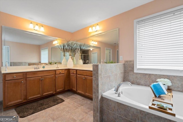 60 Heritage Keep, Covington, GA 30016 - bathroom featuring vanity, a garden tub, and tile patterned flooring