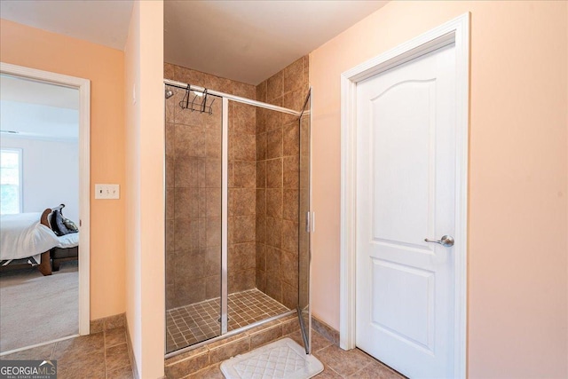 60 Heritage Keep, Covington, GA 30016 - ensuite bathroom featuring a shower stall and tile patterned flooring