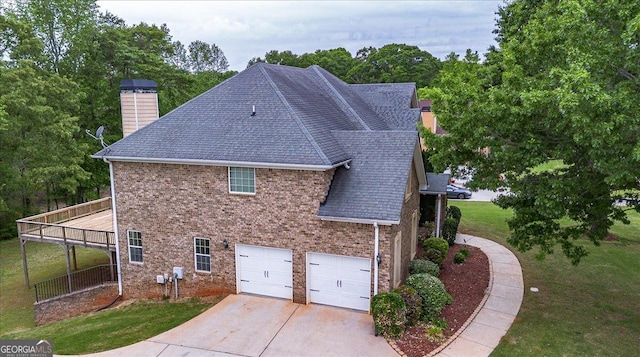 60 Heritage Keep, Covington, GA 30016 - view of home's exterior with driveway, a lawn, a garage, a chimney, and a shingled roof