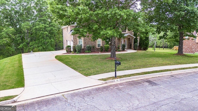 60 Heritage Keep, Covington, GA 30016 - obstructed view of property with a front yard and driveway