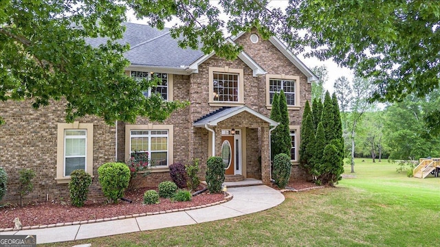 60 Heritage Keep, Covington, GA 30016 - view of front of property with a front yard and a playground