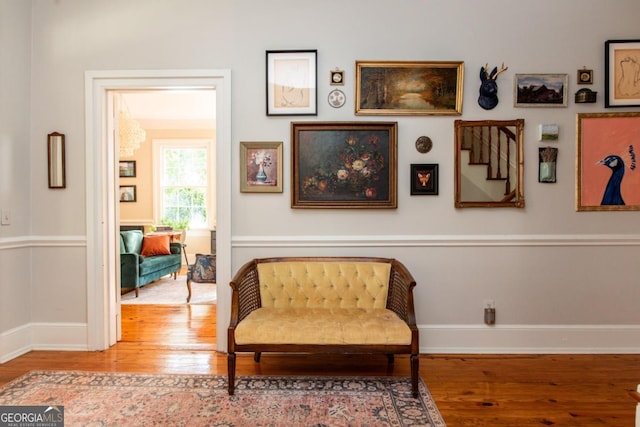 living area featuring wood finished floors and baseboards