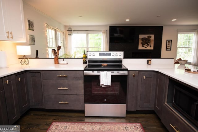 kitchen featuring electric stove, dark wood-style flooring, light countertops, dark brown cabinets, and recessed lighting