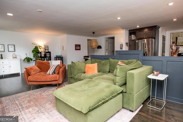 living area featuring wood finished floors and recessed lighting