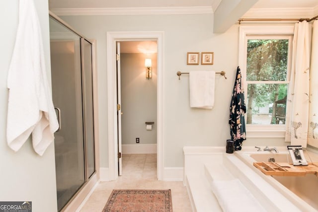 full bath featuring a stall shower, ornamental molding, a garden tub, tile patterned flooring, and baseboards