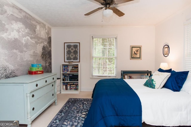 bedroom featuring ornamental molding, light carpet, and ceiling fan