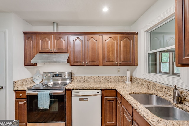 3990 Admiral Dr, Chamblee, GA 30341 - kitchen with electric range, under cabinet range hood, dishwasher, a sink, and light stone countertops