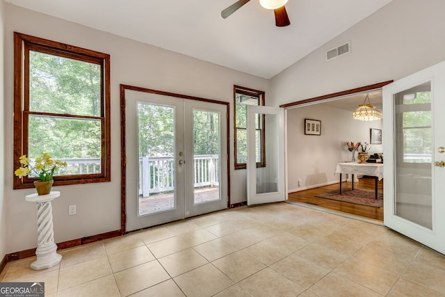 3990 Admiral Dr, Chamblee, GA 30341 - doorway to outside with french doors, healthy amount of natural light, vaulted ceiling, tile patterned flooring, and baseboards