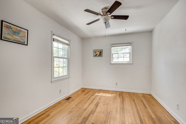 3990 Admiral Dr, Chamblee, GA 30341 - spare room featuring plenty of natural light, light wood-type flooring, and baseboards