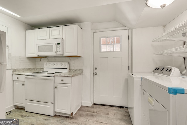 3990 Admiral Dr, Chamblee, GA 30341 - laundry room with washing machine and clothes dryer and light wood-type flooring