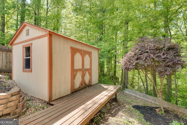 view of shed with fence
