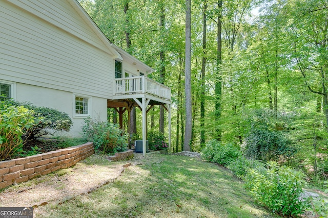 3990 Admiral Dr, Chamblee, GA 30341 - view of yard featuring central AC, a deck, and a wooded view