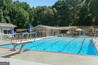 3990 Admiral Dr, Chamblee, GA 30341 - community pool featuring a patio area and a diving board