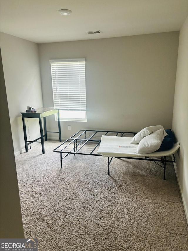 carpeted living room featuring baseboards