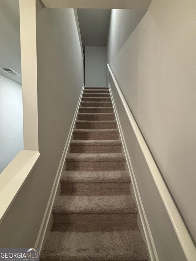 stairs with carpet flooring