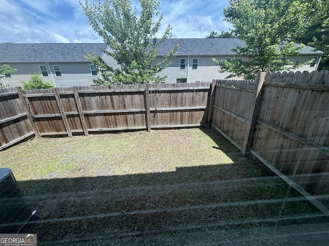 view of yard with central AC