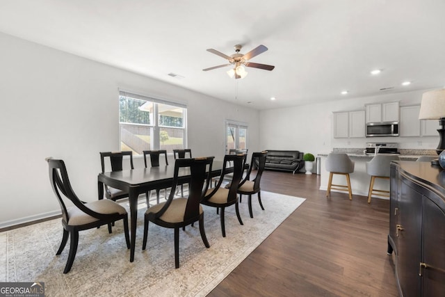 dining area featuring recessed lighting, dark wood finished floors, baseboards, and ceiling fan