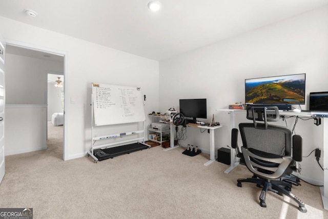 home office featuring carpet, baseboards, and ceiling fan