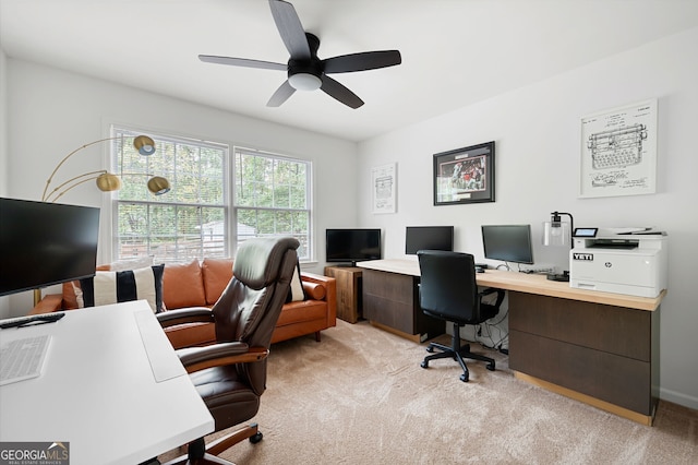 home office featuring ceiling fan and light colored carpet