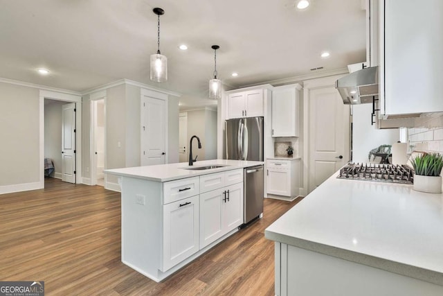 205 Farrell Creek Dr, Senoia, GA 30276 - kitchen featuring exhaust hood, stainless steel appliances, dark wood finished floors, light countertops, and recessed lighting