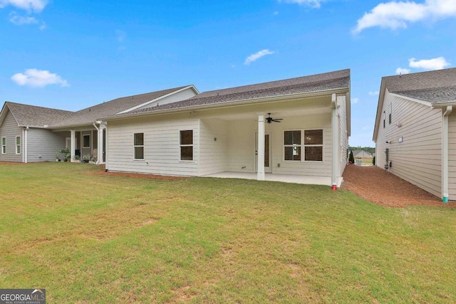 205 Farrell Creek Dr, Senoia, GA 30276 - rear view of property featuring ceiling fan, a patio area, and a lawn