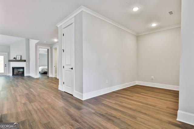 205 Farrell Creek Dr, Senoia, GA 30276 - unfurnished living room featuring wood finished floors, ornamental molding, recessed lighting, and a fireplace